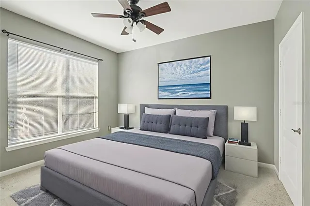 a bedroom with a large bed and a window