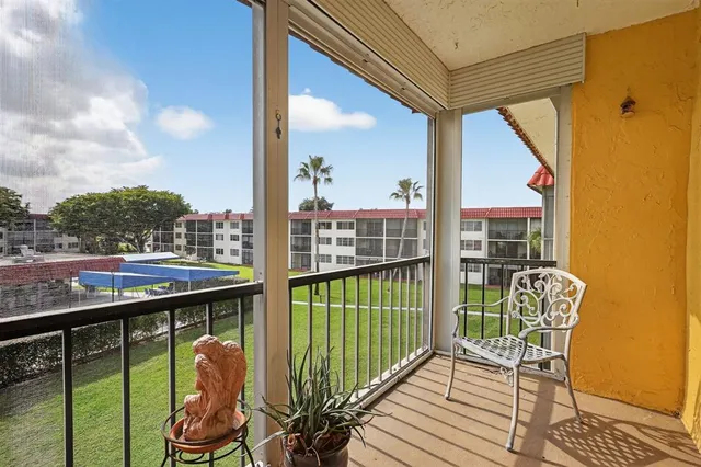 a view of a balcony with chairs