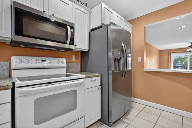 a kitchen with a stove microwave and refrigerator