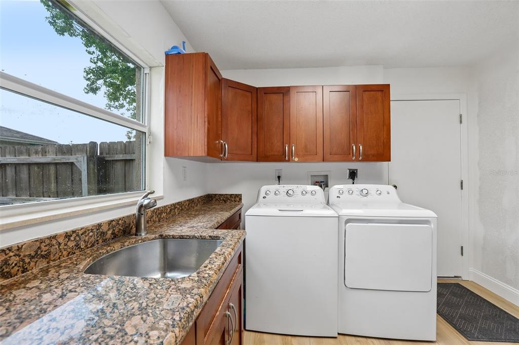 1525 Kestrel Way Brandon, FL 33511 - Photo 31 of 48 a view kitchen sink and refrigerator in a kitchen
