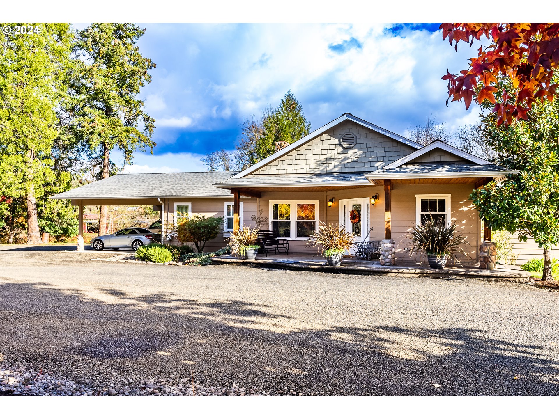 417 Elgarose Road Roseburg, OR 97471 - Photo 1 of 44 a view of a house with sitting area and garden