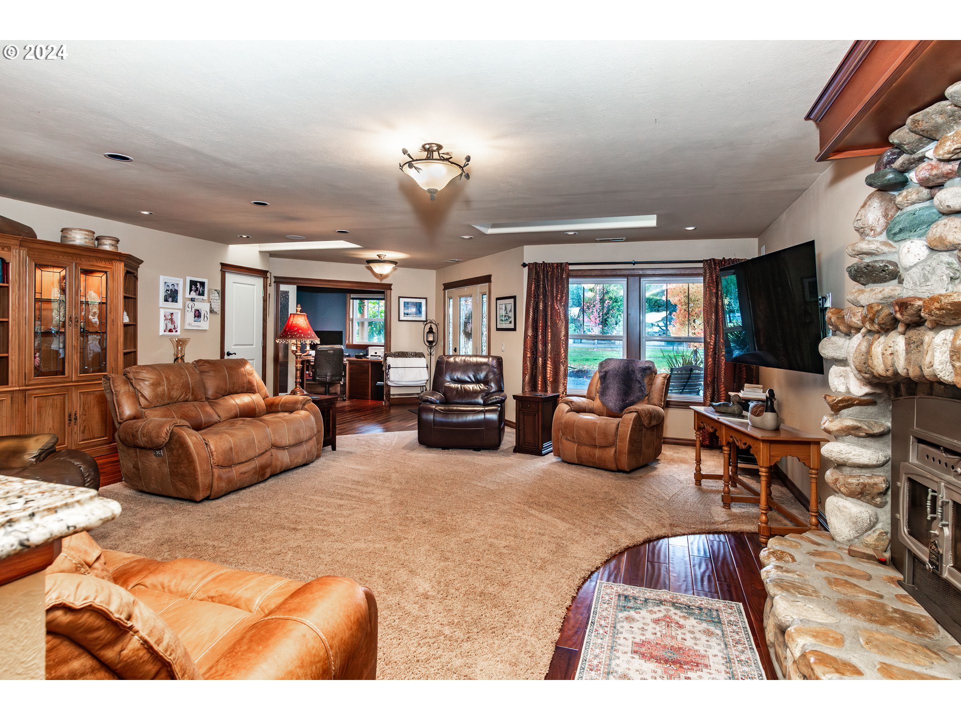 417 Elgarose Road Roseburg, OR 97471 - Photo 11 of 44 a living room with furniture hard wood floor and a chandelier