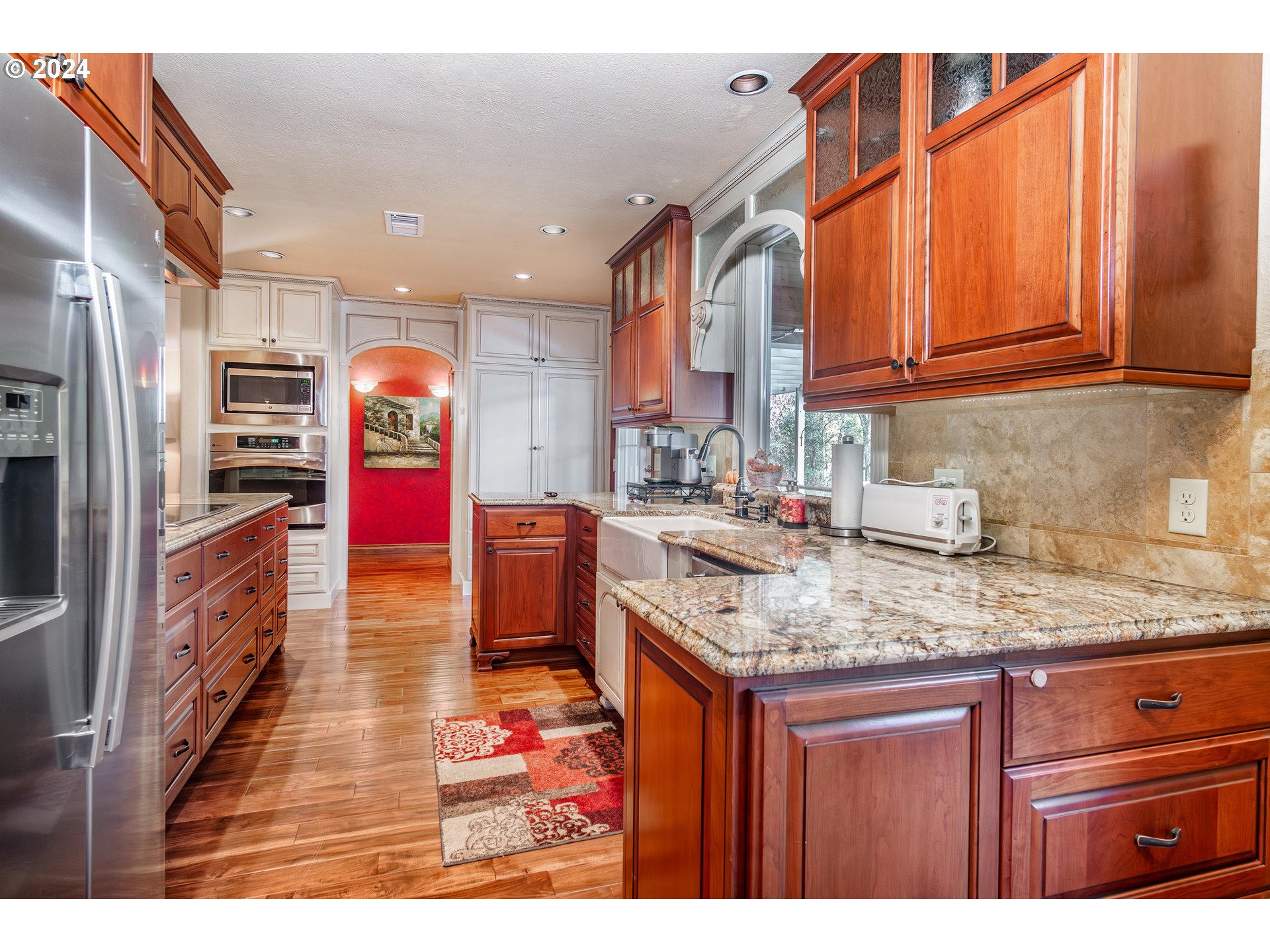 417 Elgarose Road Roseburg, OR 97471 - Photo 13 of 44 a kitchen with stainless steel appliances granite countertop a sink stove and cabinets