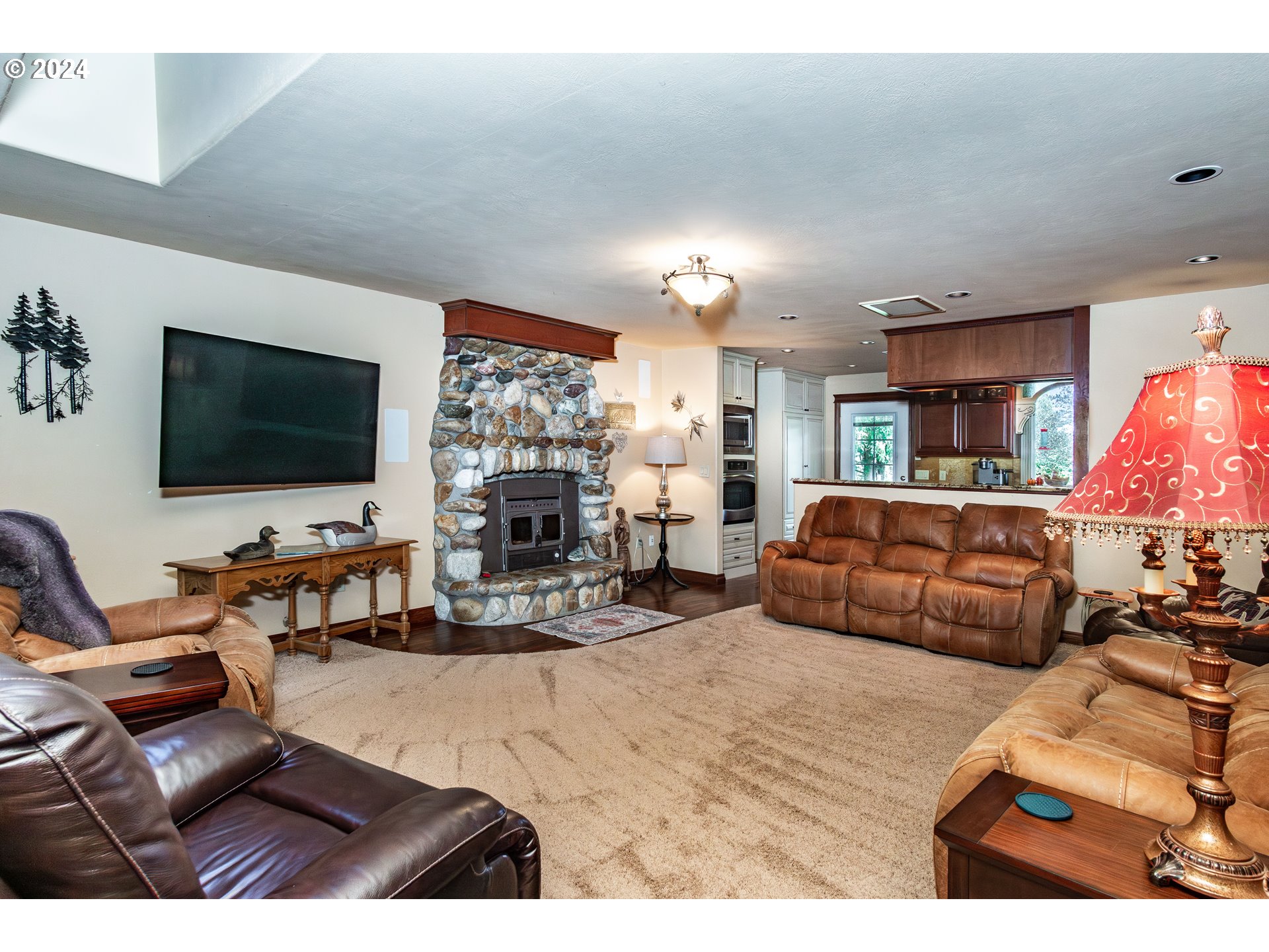 417 Elgarose Road Roseburg, OR 97471 - Photo 9 of 44 a living room with furniture flat screen tv and a chandelier