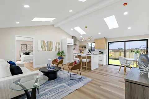a living room with furniture and a table