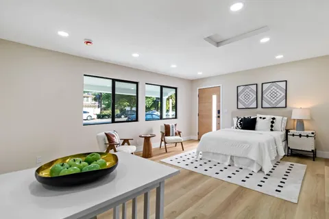 a kitchen with stainless steel appliances a stove a microwave and cabinets