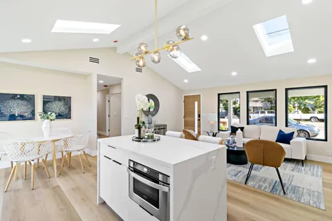 a kitchen with cabinets a sink and appliances