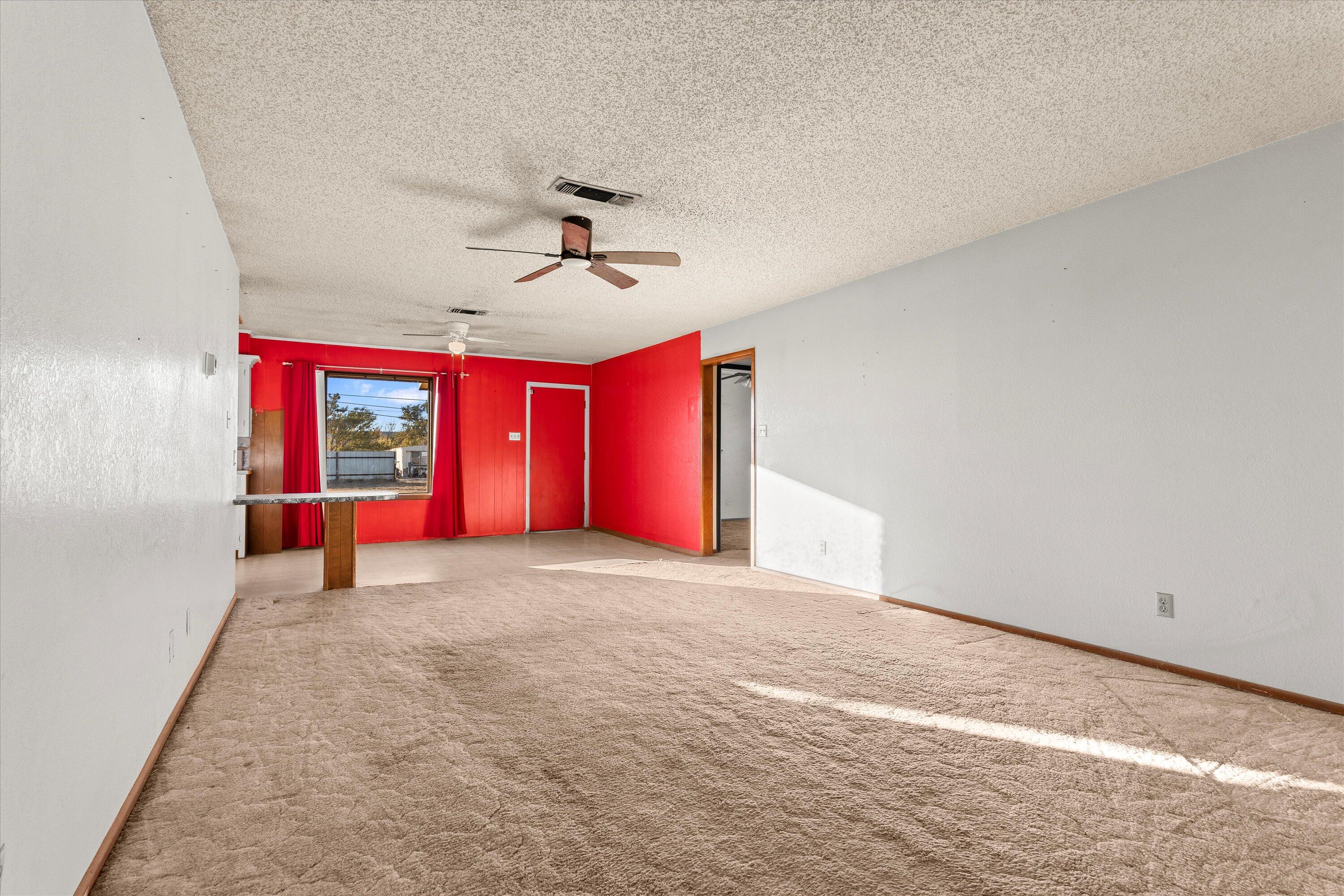 102 Eagle Avenue Levelland, TX 79336 - Photo 4 of 23 a view of an empty room with a window