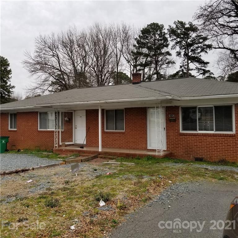 2128 North Sharon Amity Road Charlotte, NC 28212 - Photo 1 of 15 a front view of a house with garden
