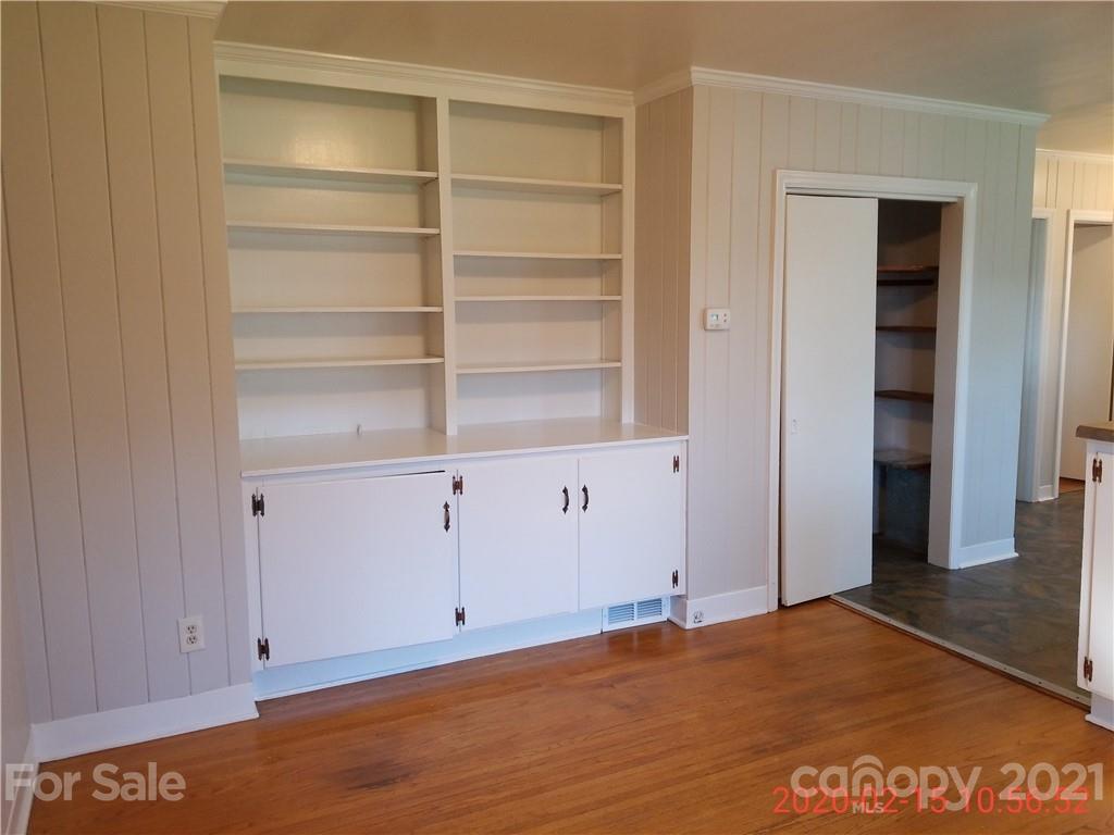 2128 North Sharon Amity Road Charlotte, NC 28212 - Photo 11 of 15 a view of an empty room with cabinet and utility room