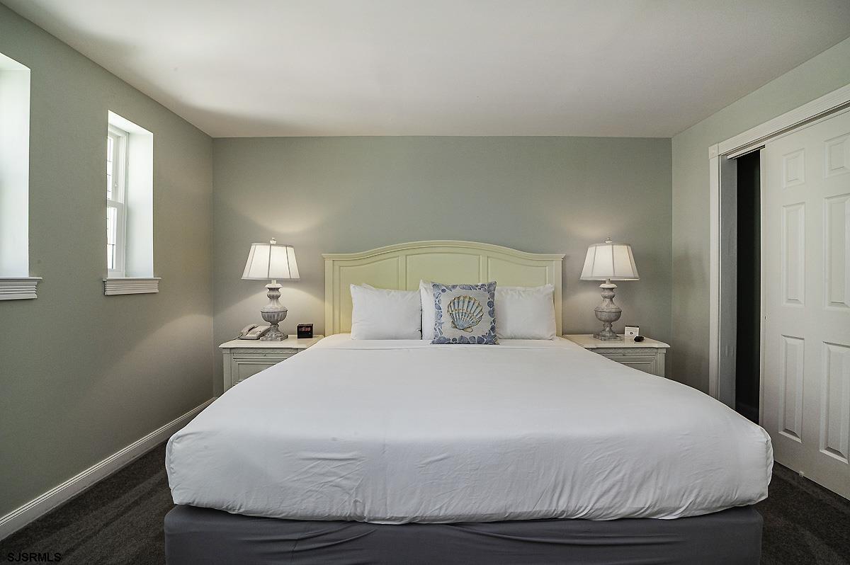 719 East 11th Street, Unit 915 Ocean City, NJ 08226 - Photo 13 of 27 a bedroom with a bed and window