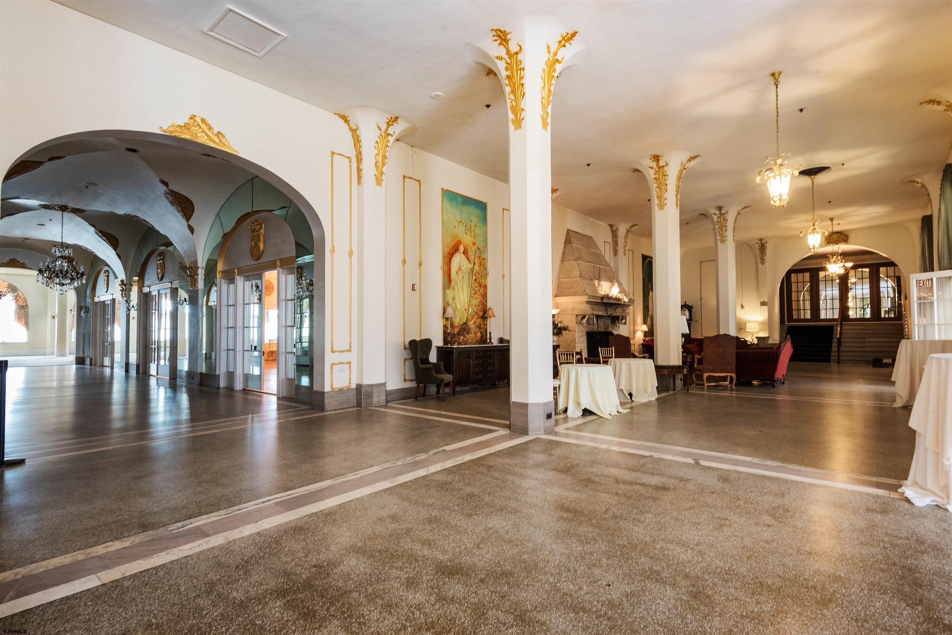 719 East 11th Street, Unit 915 Ocean City, NJ 08226 - Photo 24 of 27 a view of livingroom with dining room and couches with wooden floor