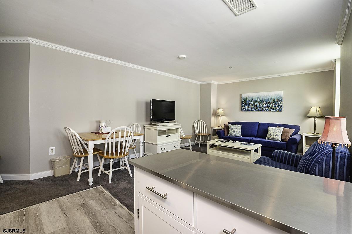 719 East 11th Street, Unit 915 Ocean City, NJ 08226 - Photo 8 of 27 a view of a livingroom with furniture and a flat screen tv