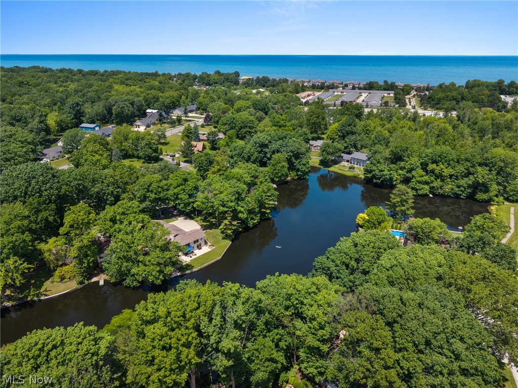 685 Sunnyside Road Vermilion, OH 44089 - Photo 43 of 50 Expansive property featuring a private pond, mature trees, waterside homes, and distant water views