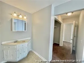 a bathroom with a tub and a sink