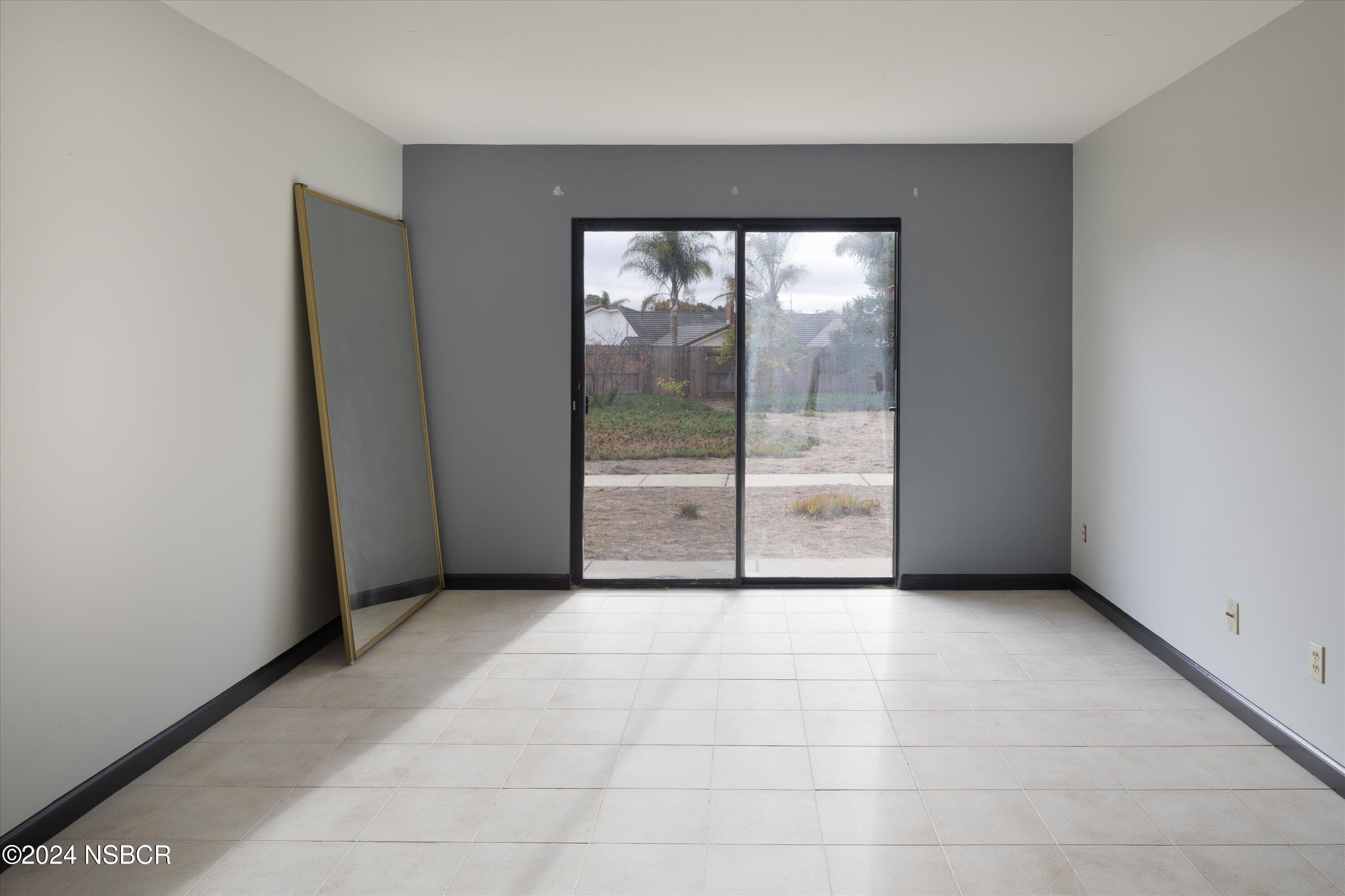 970 Onstott Road Lompoc, CA 93436 - Photo 22 of 38 an empty room with sliding glass door and shower