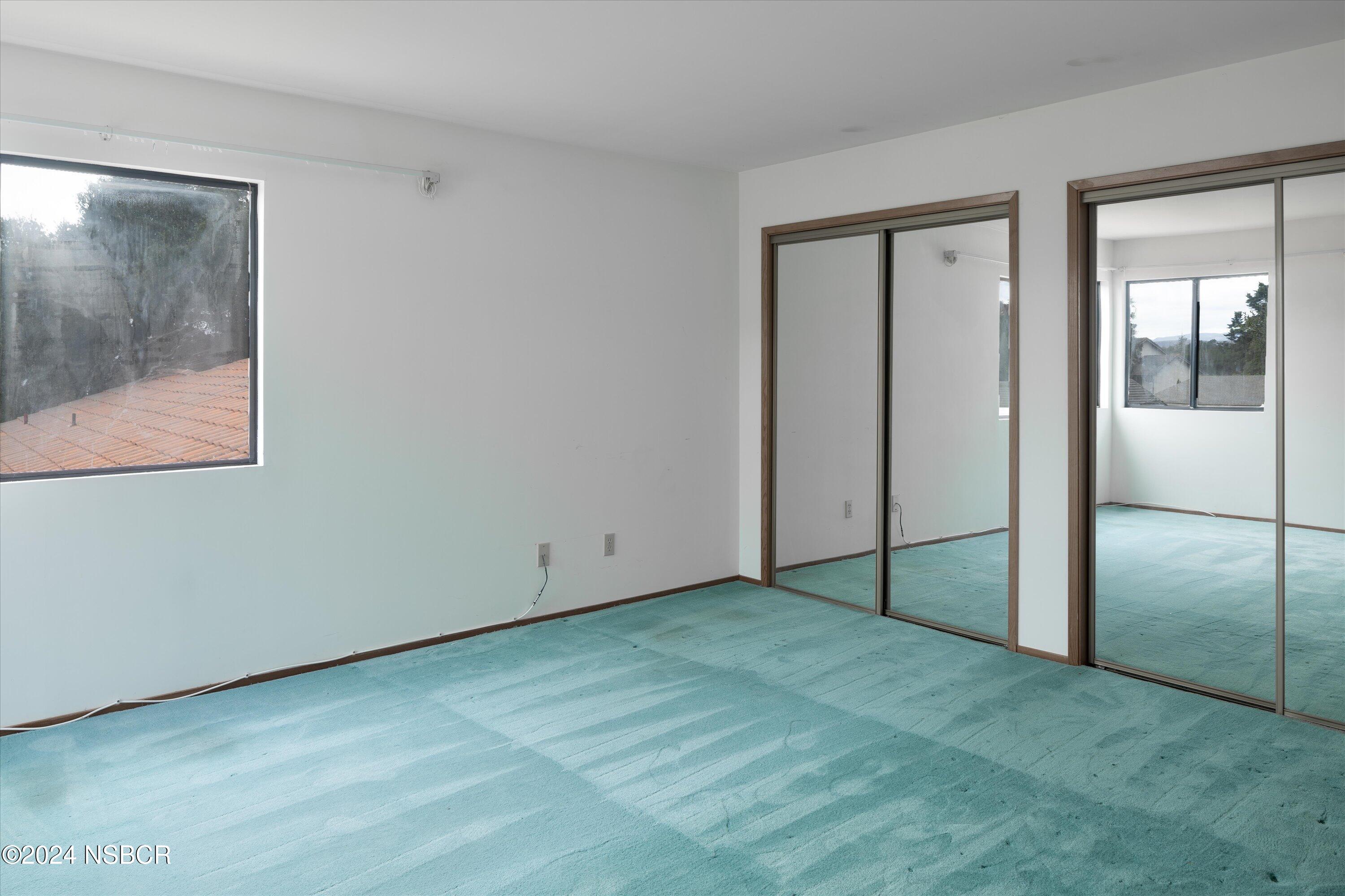 970 Onstott Road Lompoc, CA 93436 - Photo 27 of 38 a view of an empty room with closet and a window