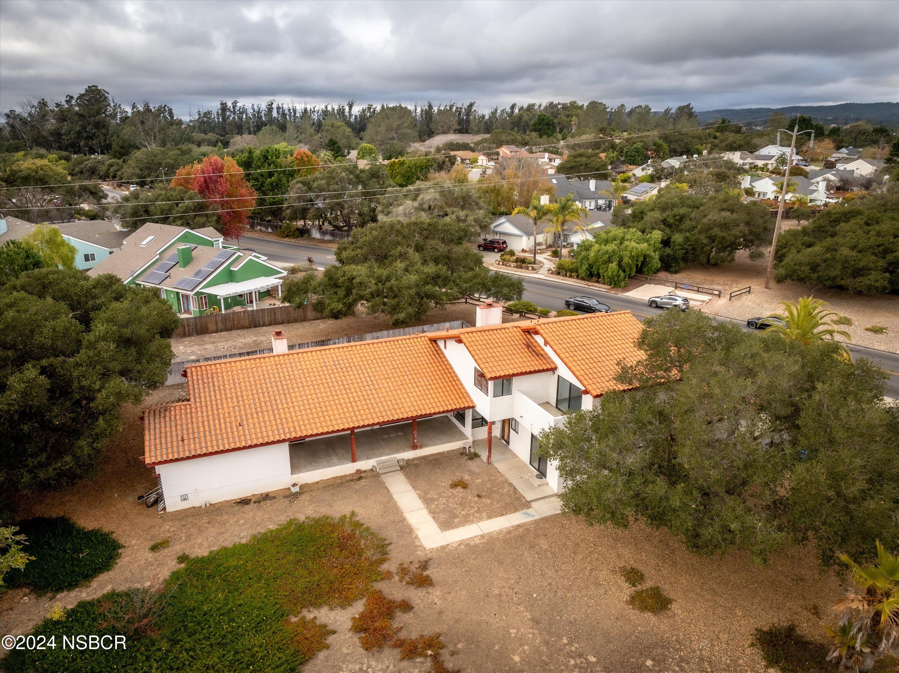 970 Onstott Road Lompoc, CA 93436 - Photo 34 of 38 an aerial view of a house with a yard and lake view