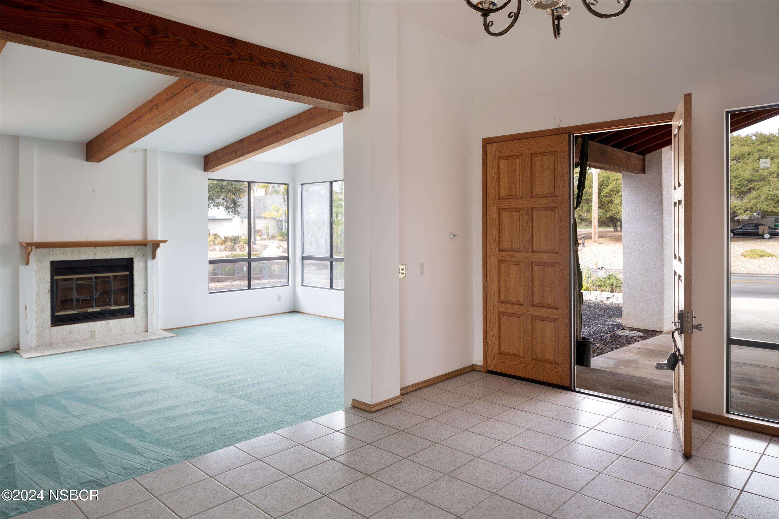 970 Onstott Road Lompoc, CA 93436 - Photo 7 of 38 a view of a livingroom with an empty space and a fireplace