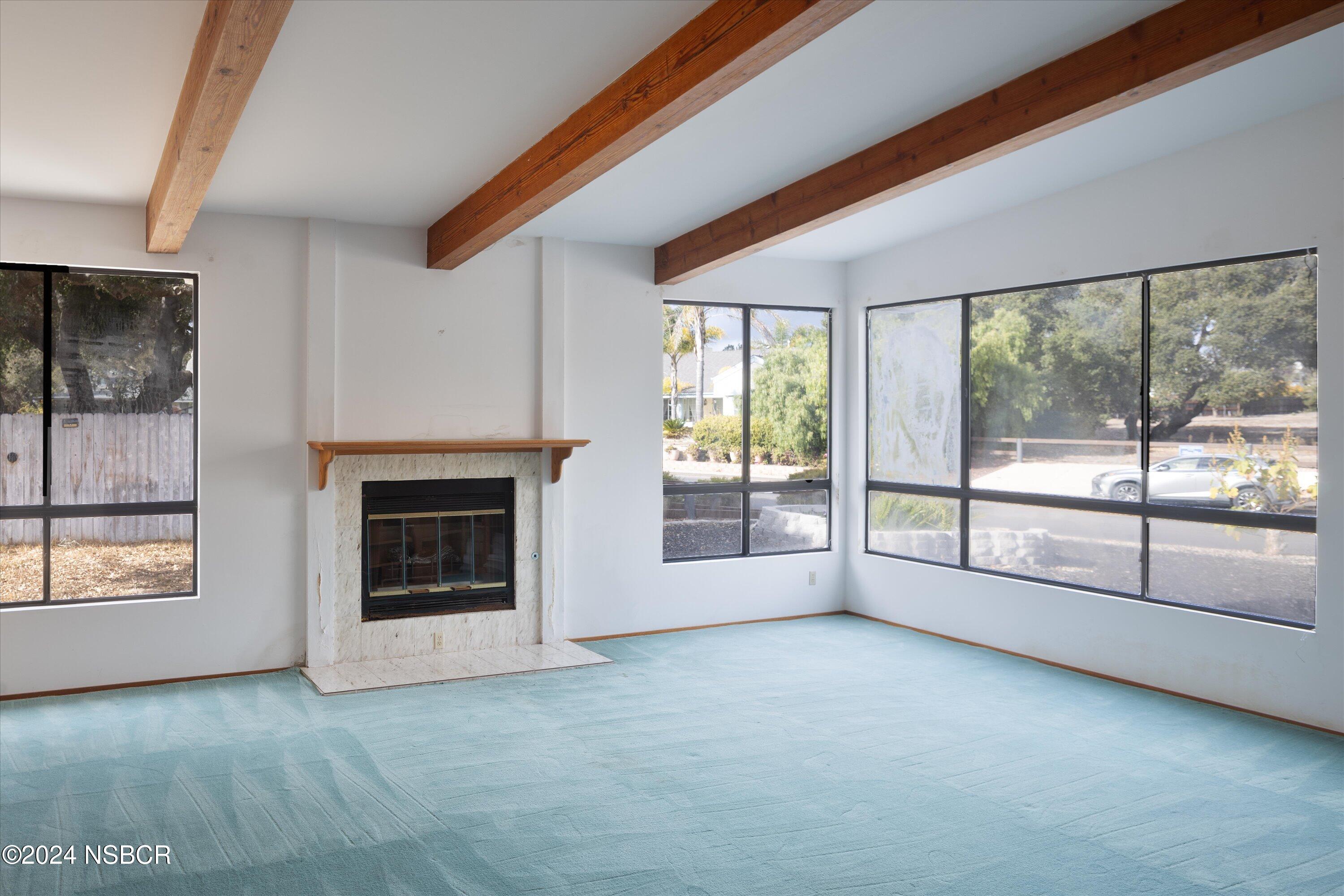 970 Onstott Road Lompoc, CA 93436 - Photo 8 of 38 a view of an empty room with a fireplace and a window