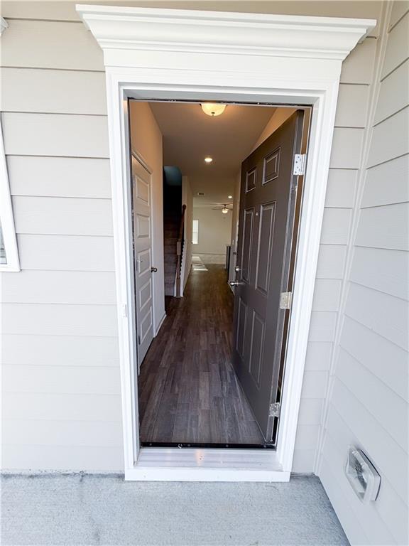 145 Red Oak Lane Calhoun, GA 30701 - Photo 2 of 18 a view of a hallway with wooden floor and staircase