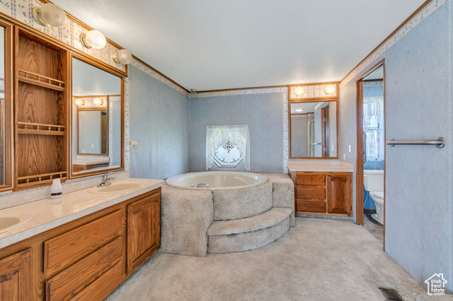 12958 South 300 East Draper, UT 84020 - Photo 35 of 38 Bathroom featuring a garden tub, double vanity, and ornamental molding