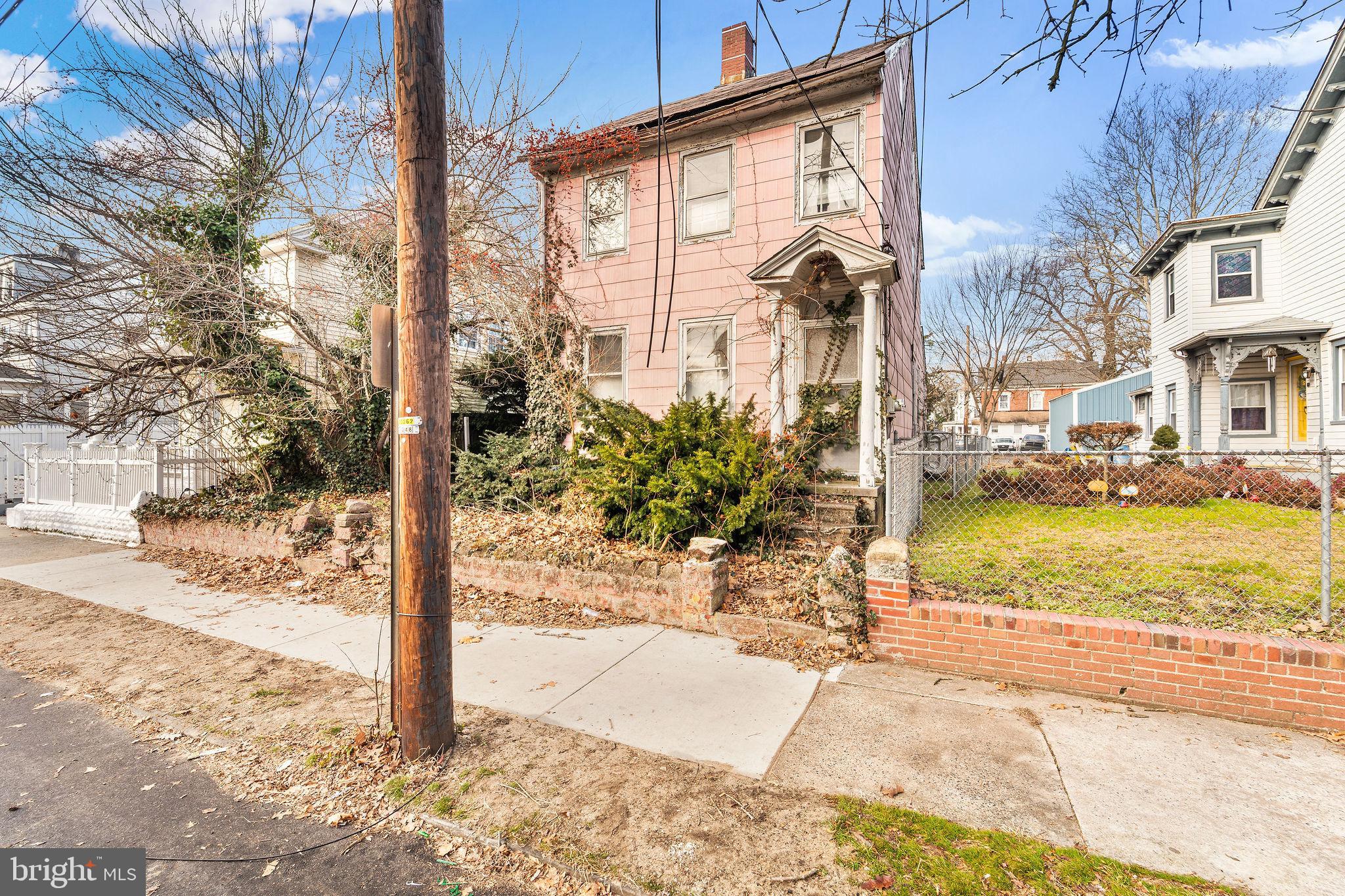 64 Walnut Street Bridgeton, NJ 08302 - Photo 3 of 26 a view of a porch with a tree