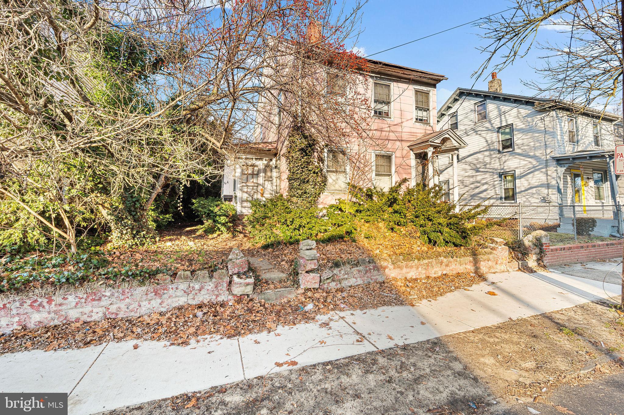 64 Walnut Street Bridgeton, NJ 08302 - Photo 4 of 26 a view of a pathway with a yard