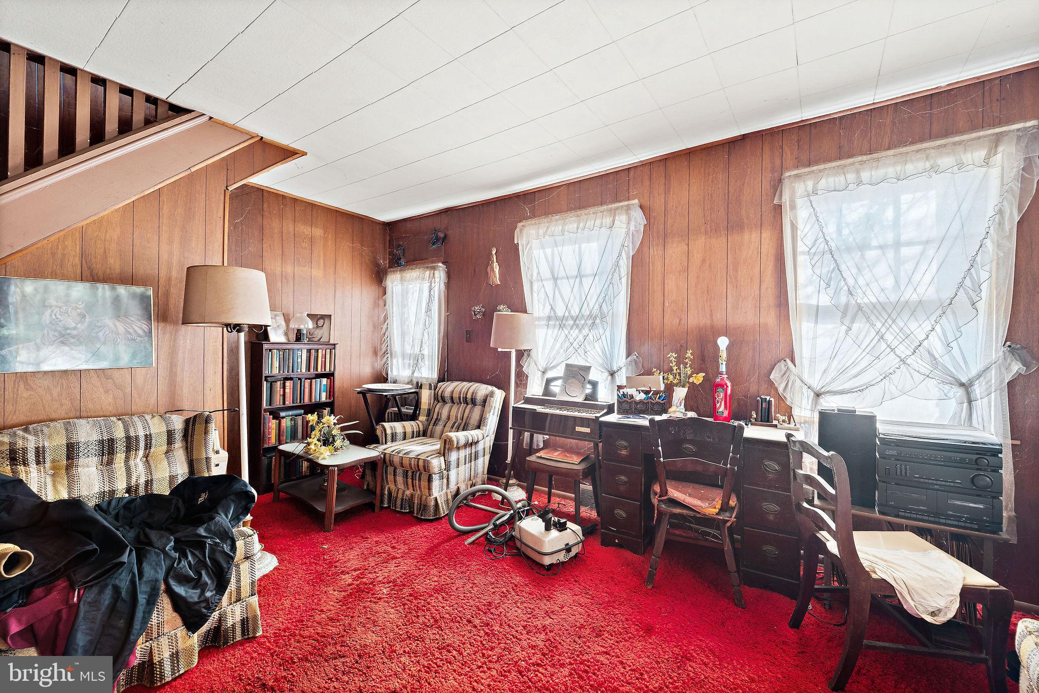 64 Walnut Street Bridgeton, NJ 08302 - Photo 6 of 26 a room with furniture toys and a large window