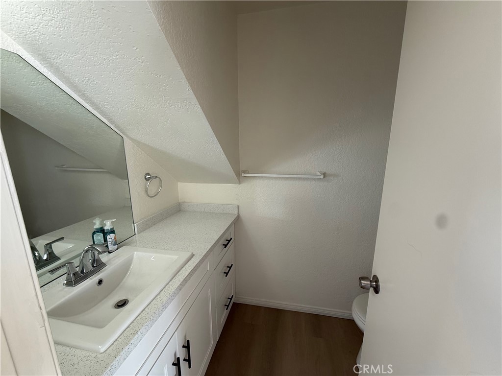5010 Brooks Street, Unit 2 Riverside, CA 92506 - Photo 7 of 22 a bathroom with a sink and a mirror