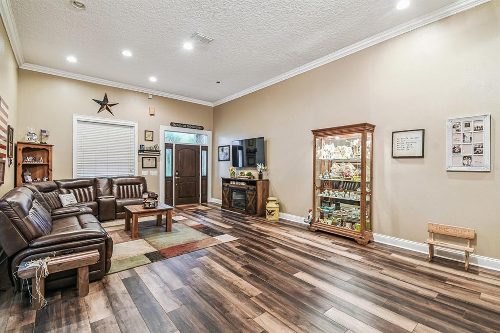 19315 Lake Pickett Road Orlando, FL 32820 - Photo 13 of 90 a living room with furniture and a wooden floor