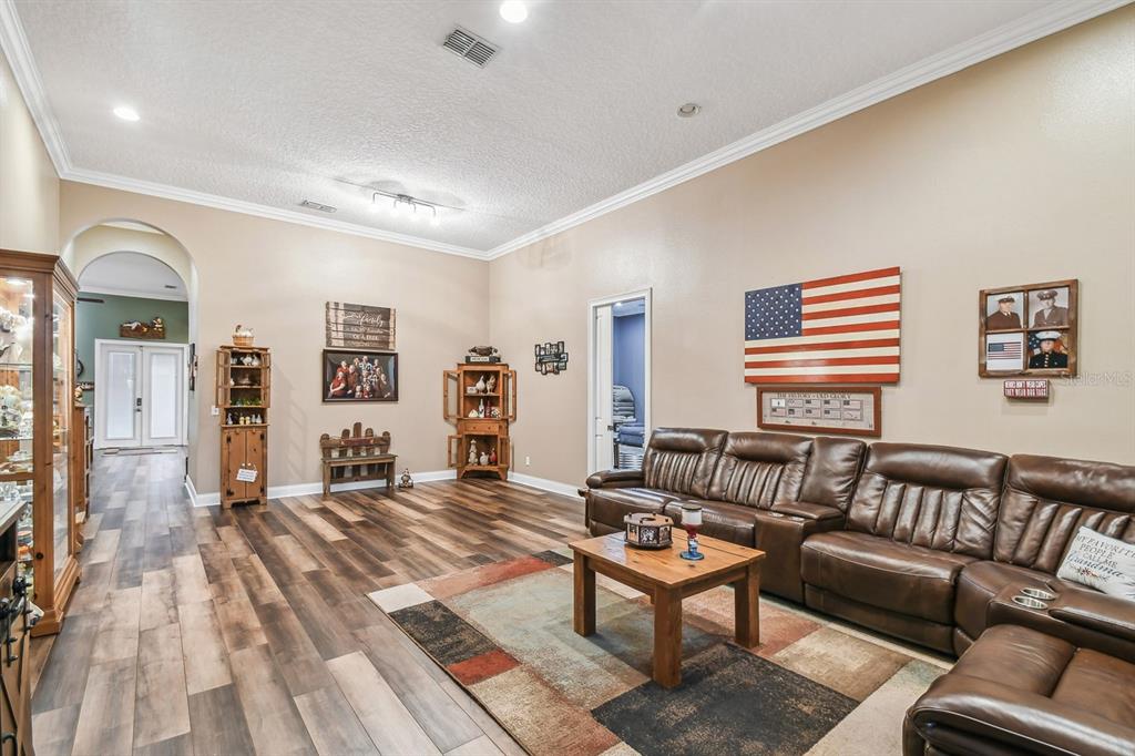 19315 Lake Pickett Road Orlando, FL 32820 - Photo 14 of 90 a living room with furniture and a rug