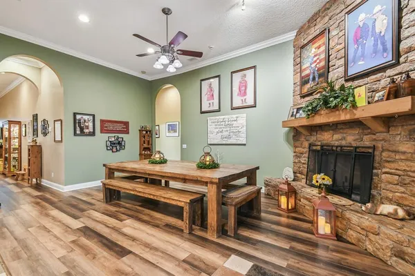 a living room with furniture and floor to ceiling window