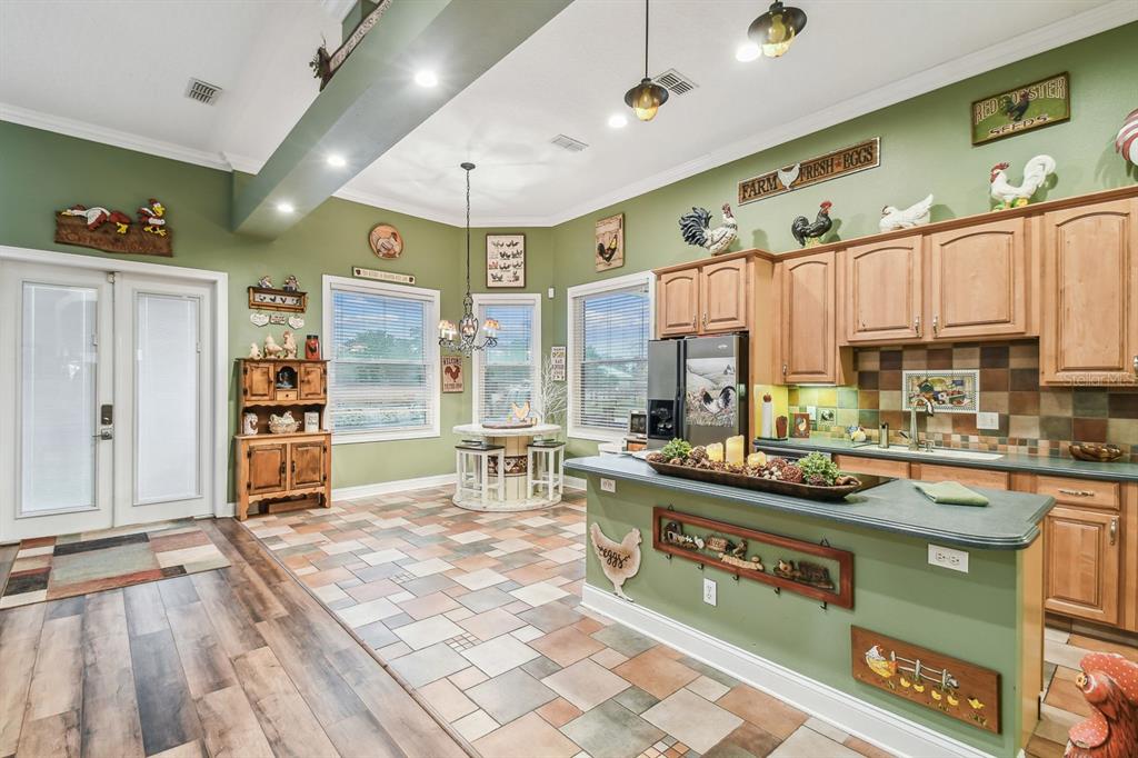 19315 Lake Pickett Road Orlando, FL 32820 - Photo 20 of 90 a kitchen with stainless steel appliances granite countertop a stove a sink and a refrigerator with cabinets