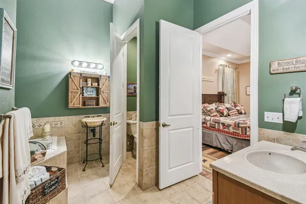 a large kitchen with a table and chairs
