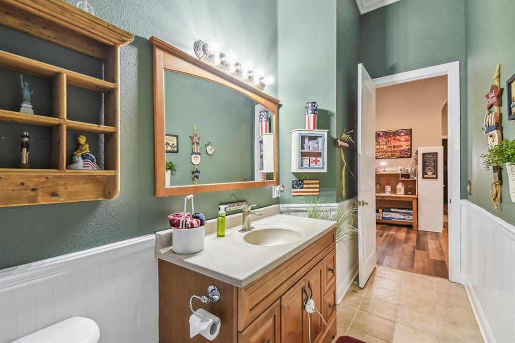 19315 Lake Pickett Road Orlando, FL 32820 - Photo 31 of 90 a bathroom with a sink a vanity and a mirror