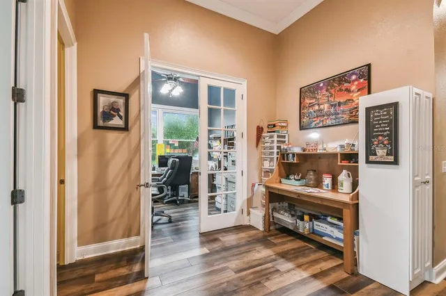 a bedroom with a bed and a large mirror with a flat tv screen