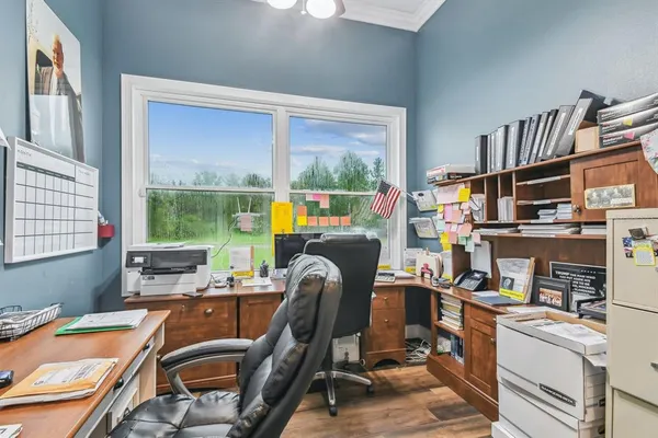 a bedroom with a bed and a television