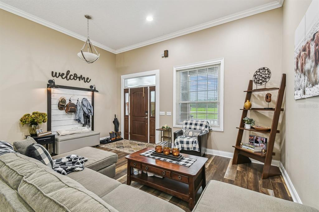 19315 Lake Pickett Road Orlando, FL 32820 - Photo 34 of 90 a living room with furniture and floor to ceiling window