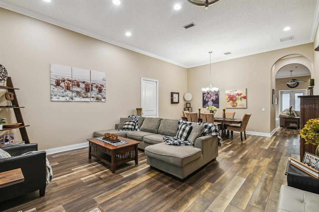 19315 Lake Pickett Road Orlando, FL 32820 - Photo 36 of 90 a living room with furniture a couch and a flat screen tv