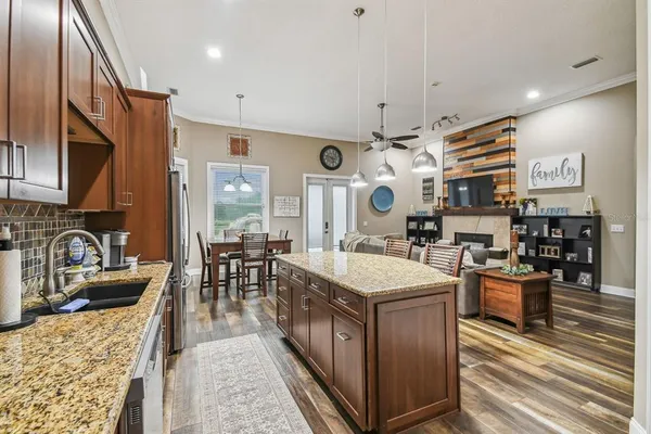 a view of a house with swimming pool and sitting area