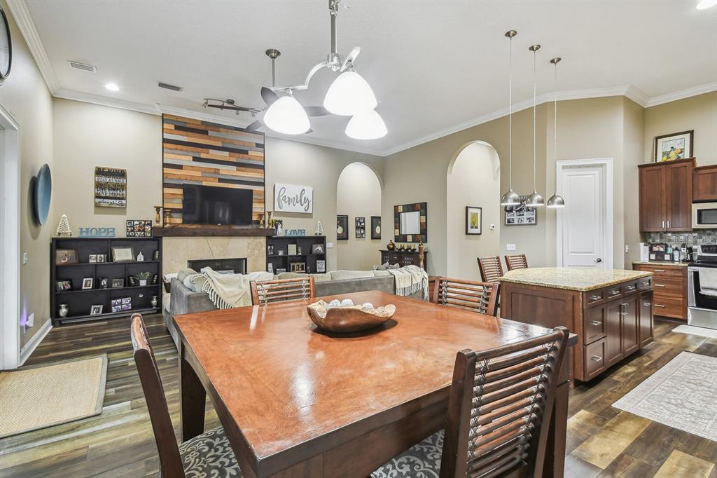 19315 Lake Pickett Road Orlando, FL 32820 - Photo 45 of 90 a large kitchen with a table and chairs