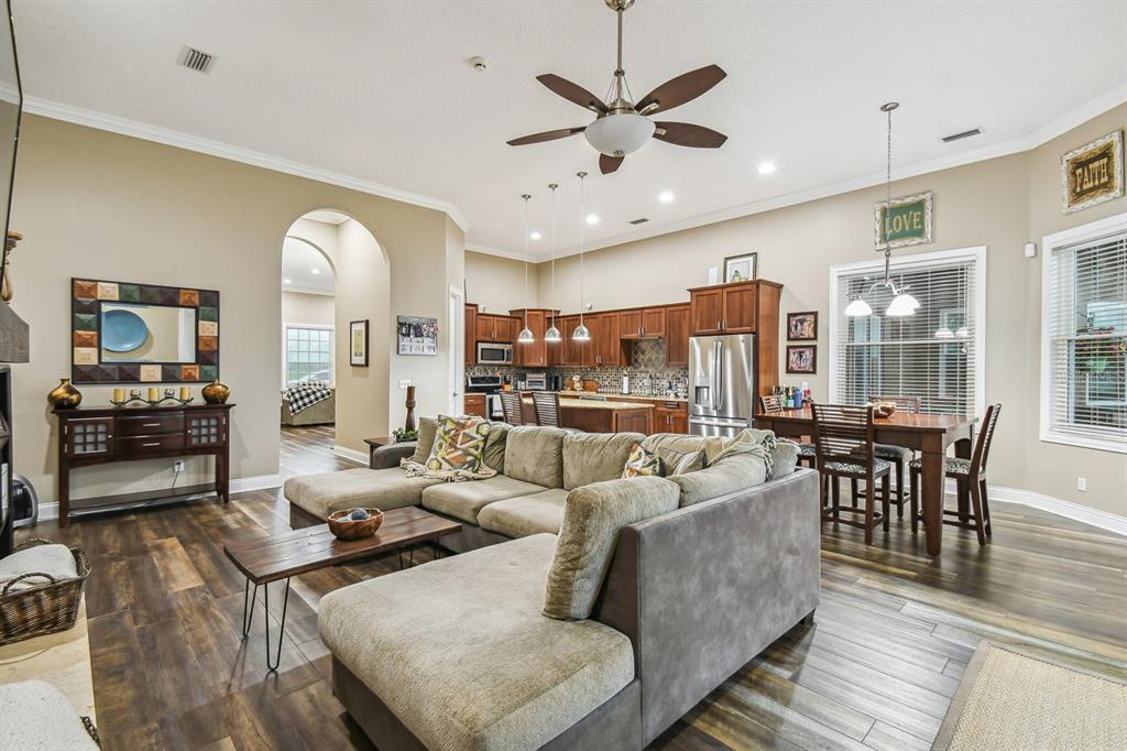 19315 Lake Pickett Road Orlando, FL 32820 - Photo 46 of 90 a living room with furniture and a large window