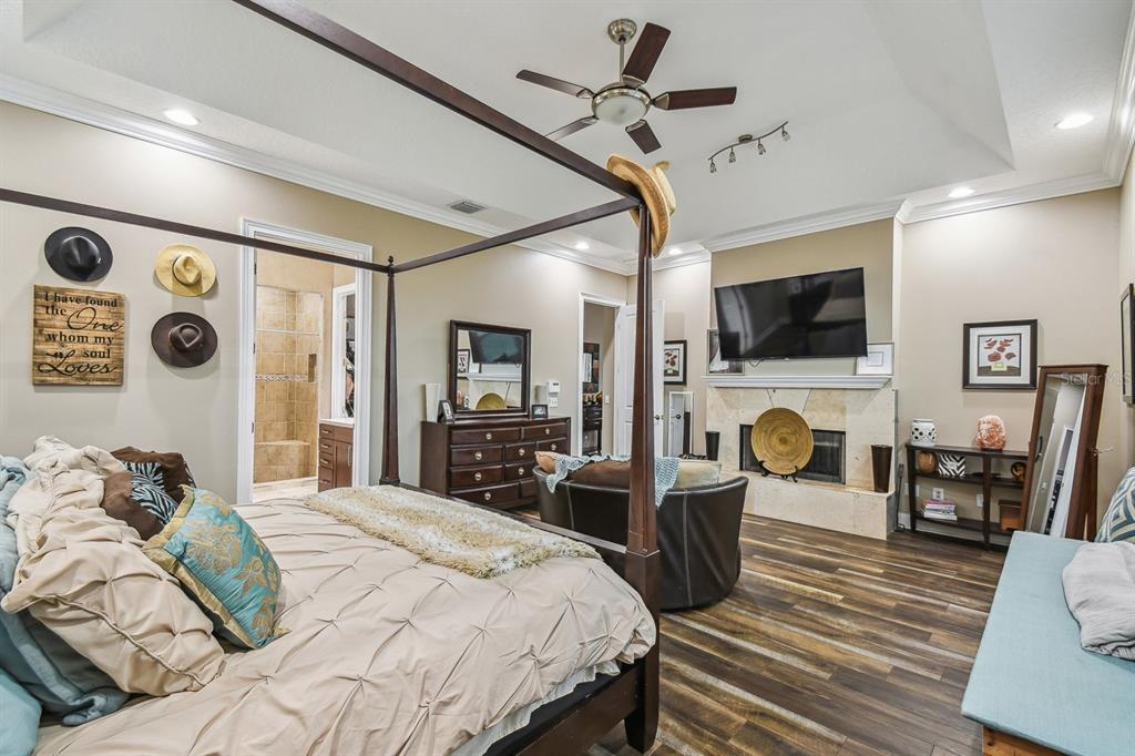 19315 Lake Pickett Road Orlando, FL 32820 - Photo 47 of 90 a bedroom with a bed a flat screen tv and dresser