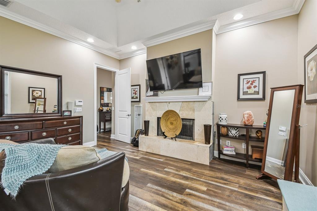 19315 Lake Pickett Road Orlando, FL 32820 - Photo 48 of 90 a living room with furniture and a flat screen tv