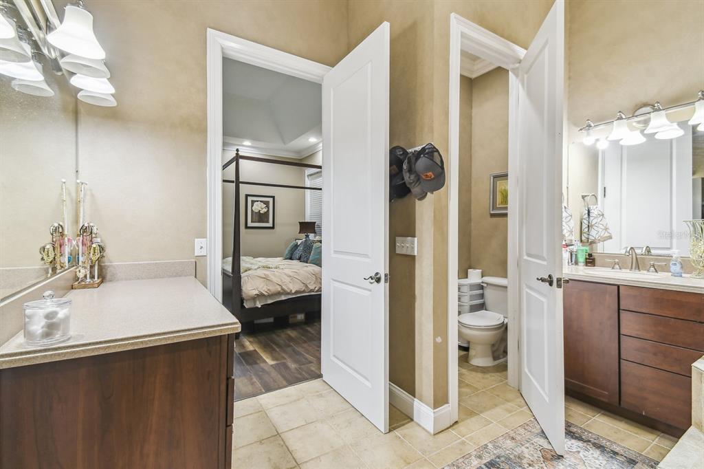 19315 Lake Pickett Road Orlando, FL 32820 - Photo 52 of 90 a en suite bathroom with a sink toilet and shower