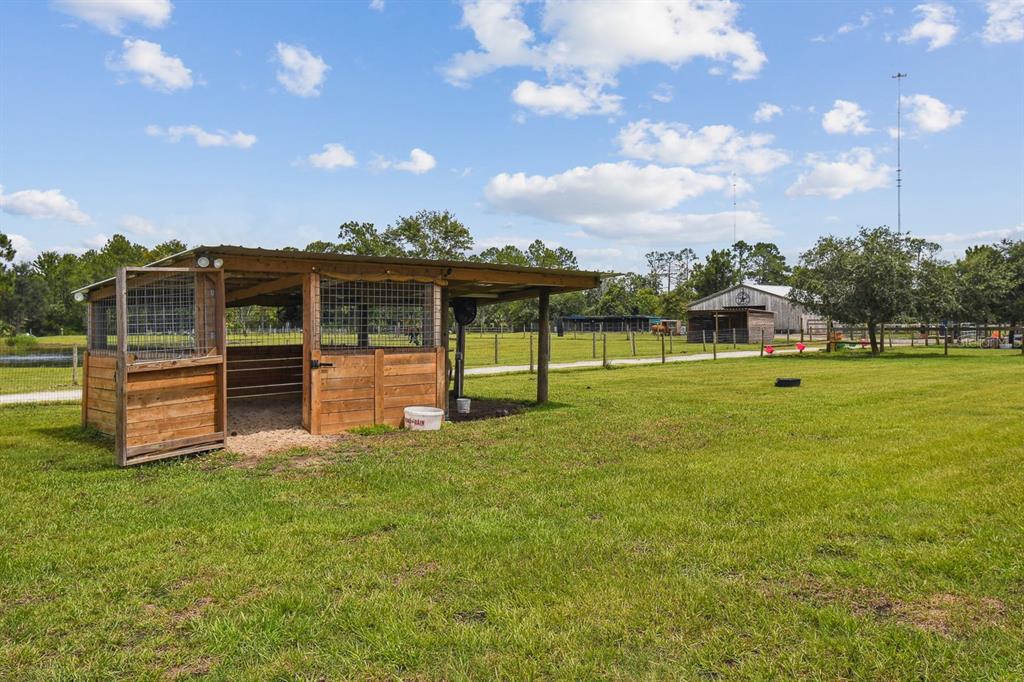 19315 Lake Pickett Road Orlando, FL 32820 - Photo 83 of 90 a view of a house with a big yard
