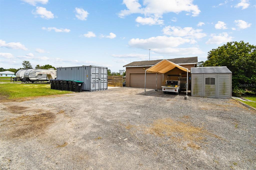 19315 Lake Pickett Road Orlando, FL 32820 - Photo 87 of 90 a view of a house with a yard and sitting area