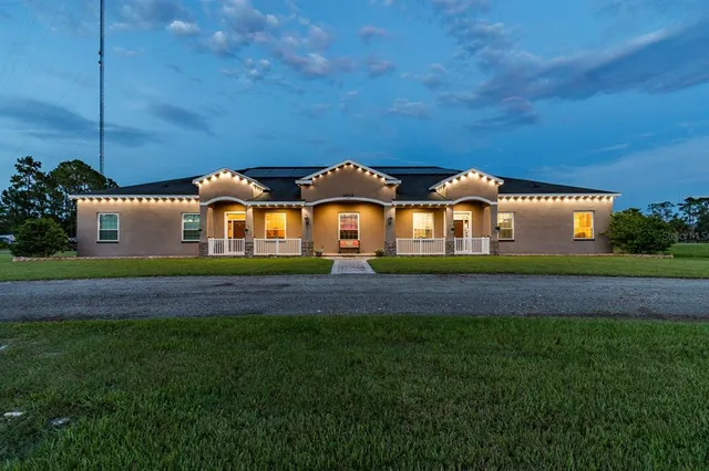 a kitchen with stainless steel appliances granite countertop a stove a sink and a refrigerator with cabinets