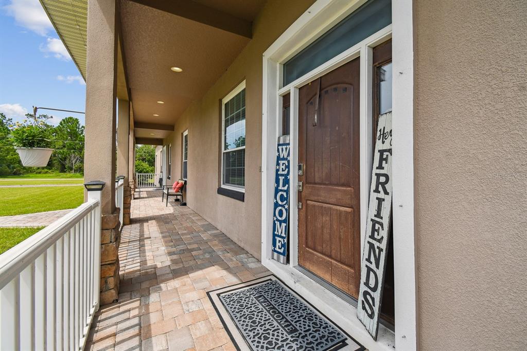 19315 Lake Pickett Road Orlando, FL 32820 - Photo 10 of 90 a view of a hallway with a dinning table and chairs